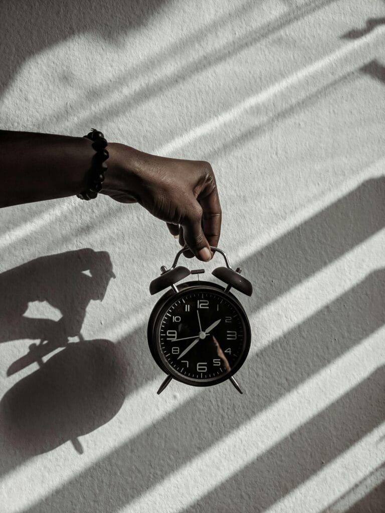 pexels-photo-3463090-3463090 Person Holding a Alarm Clock